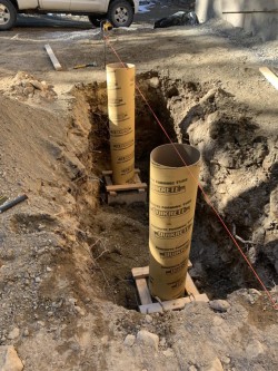 Quikrete tubes in excavated dirt