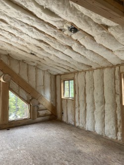 Framework for custom home with insulation and two windows