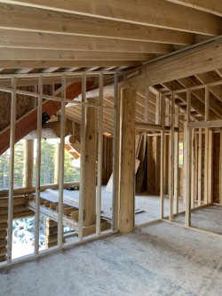 Framework for upstairs rooms in multistory log cabin