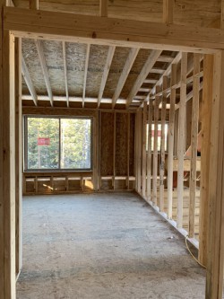 Framework for custom cabin with arched interior doorway