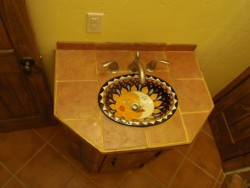 Custom porcelain sink with painted sun