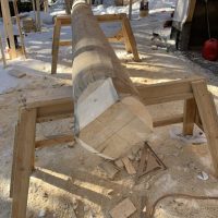 Partially sawed wooden beam
