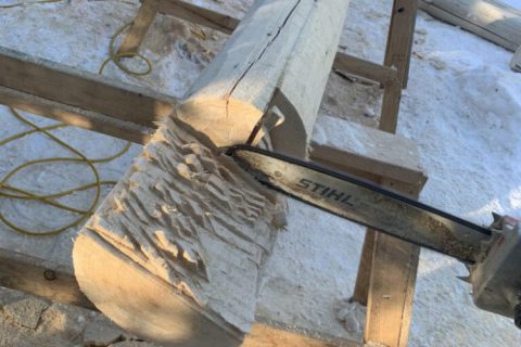 Cutting a log for a log home facet